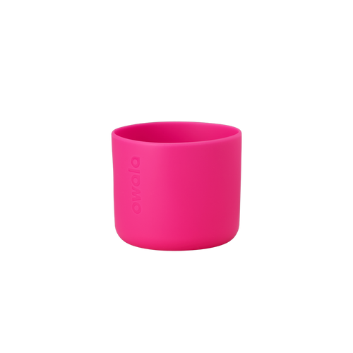 Owala Bottle Boot in vivid hot pink silicone with tonal Owala logo, short cylindrical form sized for 16oz Kids' FreeSip bottles