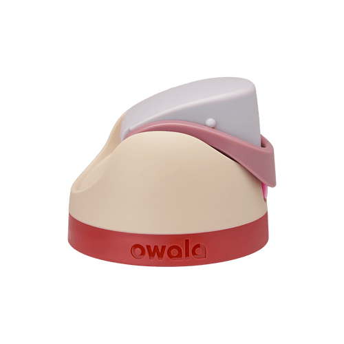 Owala FreeSip replacement lid in Can You See Me?, cream beige body with light lavender flip cap, dusty pink carry loop, and red accent band